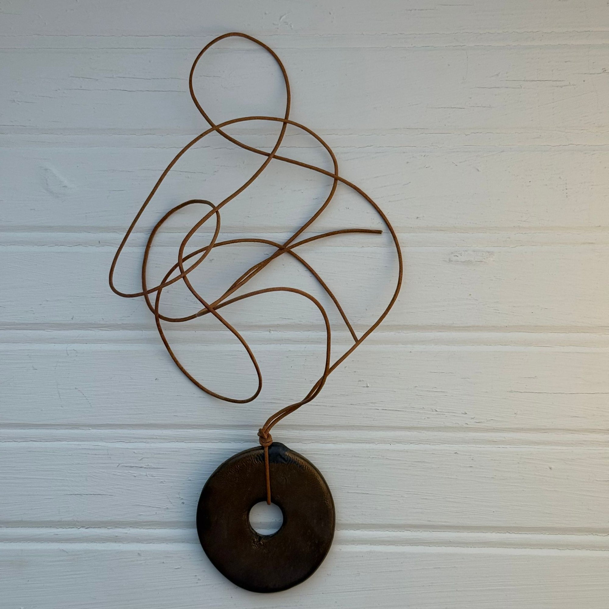 Bronze Disc on Leather Cord