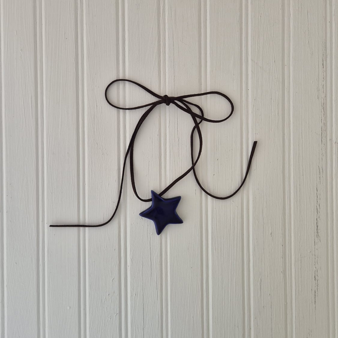 Navy Star on Leather cord
